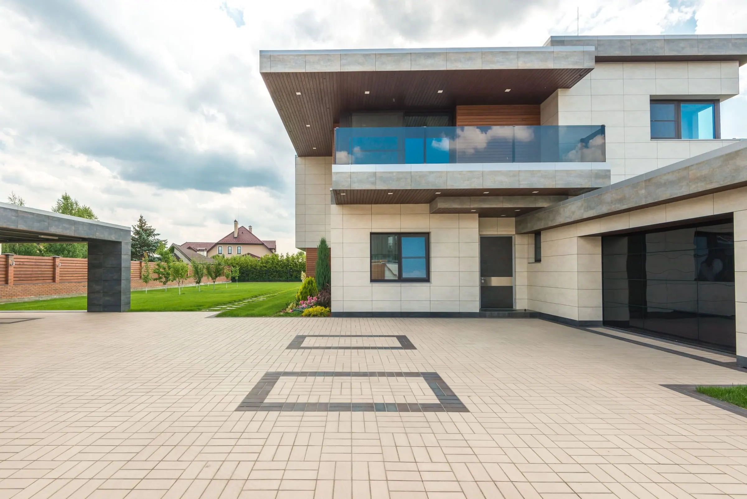 Large-format paver driveway with contrast borders