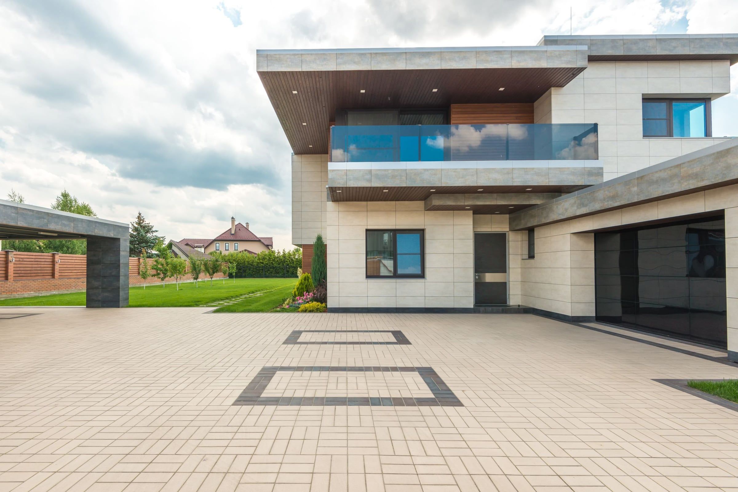 Large interlocking paver driveway at a modern home