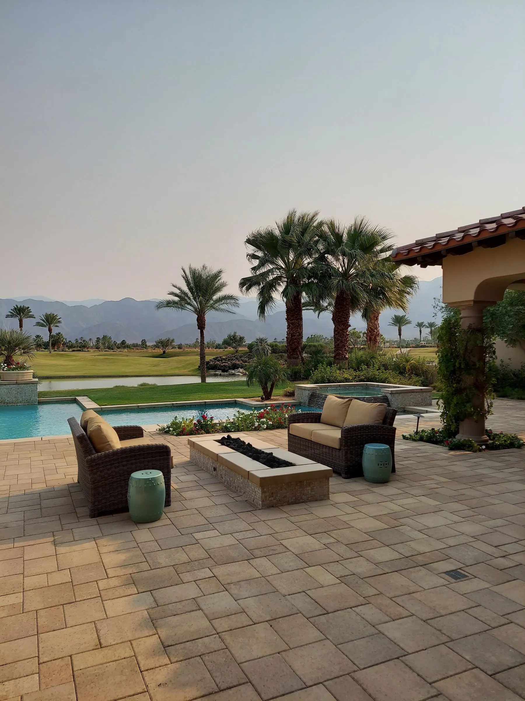 Paver patio with fire table and lounge seating